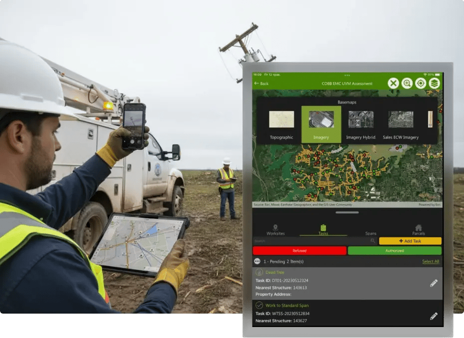 Utility worker using GPS device to map utility lines near damaged pole.