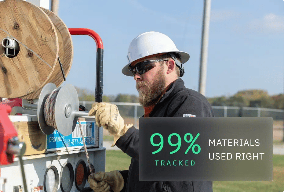 Worker handling cable with tracking system showing 99% efficiency.