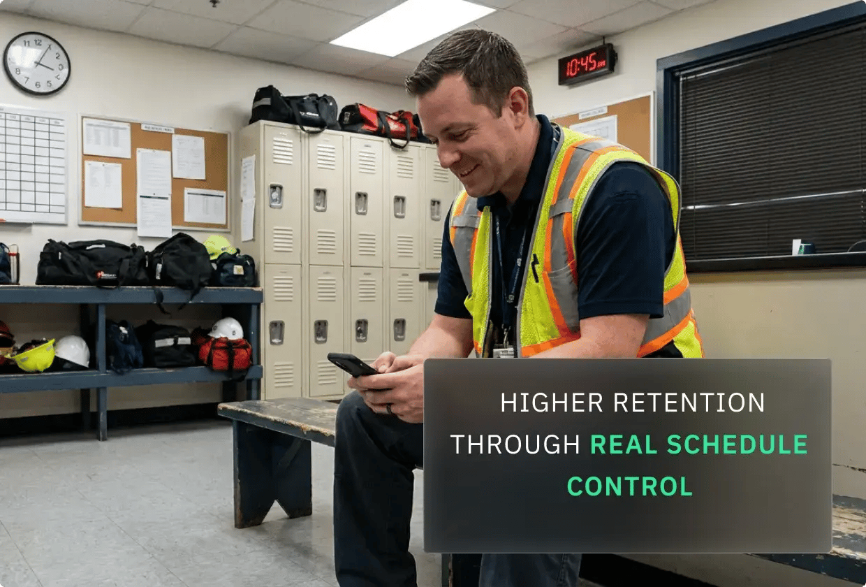 A uniformed worker checks a smartphone