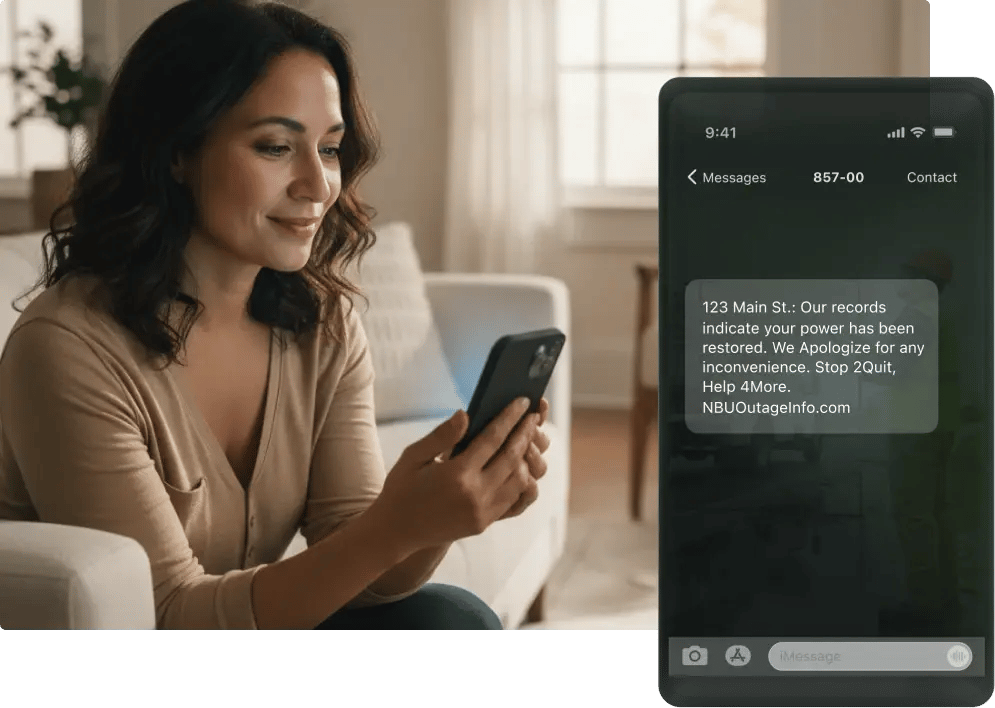 Woman checking phone with power restoration message.