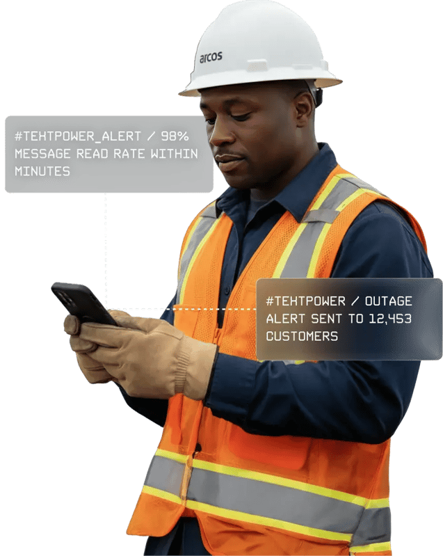 Worker using smartphone to send outage alerts