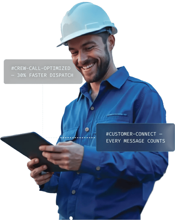 A worker in a blue shirt and hard hat holds a tablet, displaying messages about crew call optimization and customer connectivity.