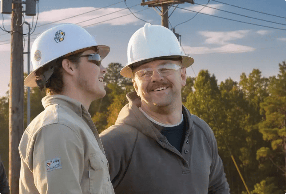 utility workers talking and smiling