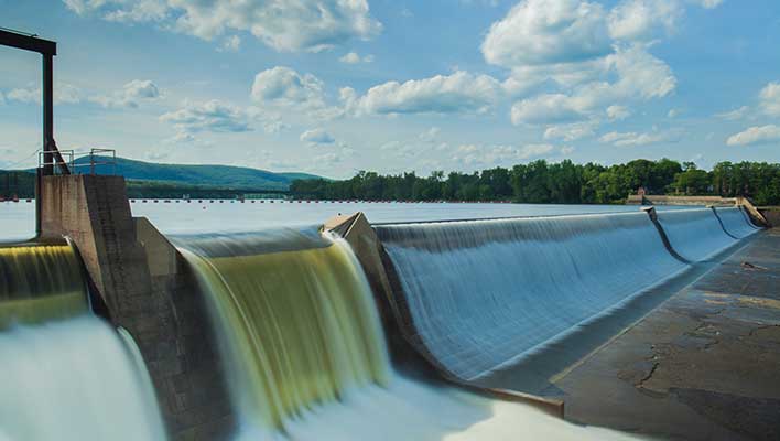 Water flowing over a dam