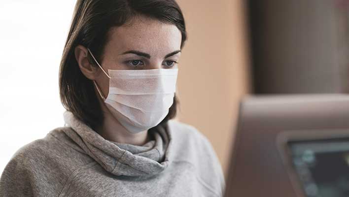Young woman in a surgical mask