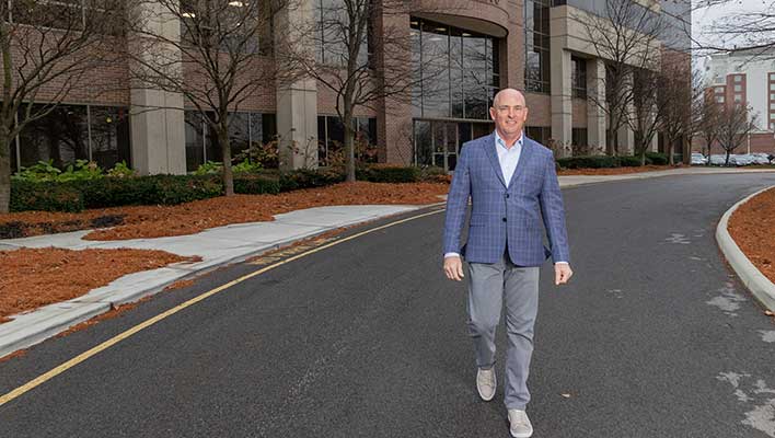 Odus Wittenburg walking outside of ARCOS HQ