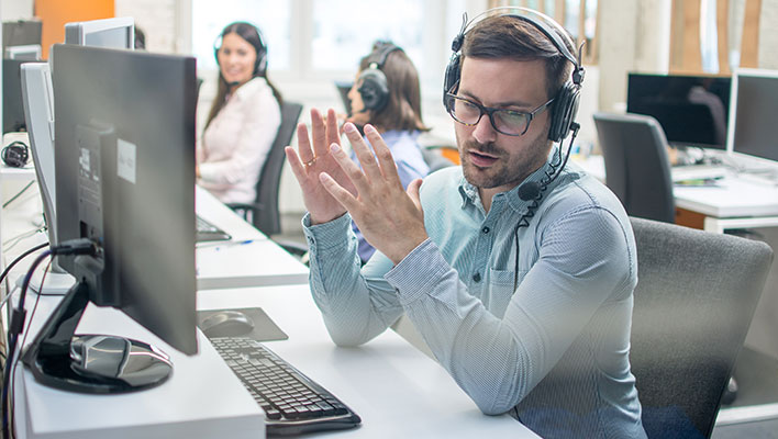 A utility support specialist providing customer support on the phone