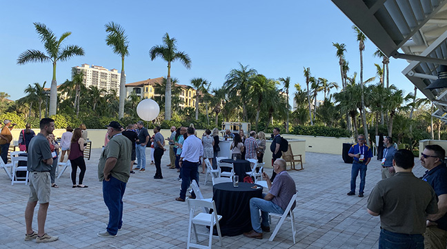 ARCOS customers and employees mingle during a happy hour event