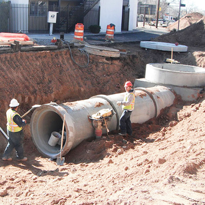 Utility workers fixing a pipeline