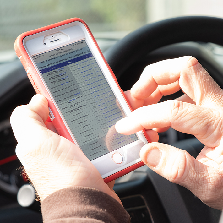 Close view of hands holding a cell phone with ARCOS Callout