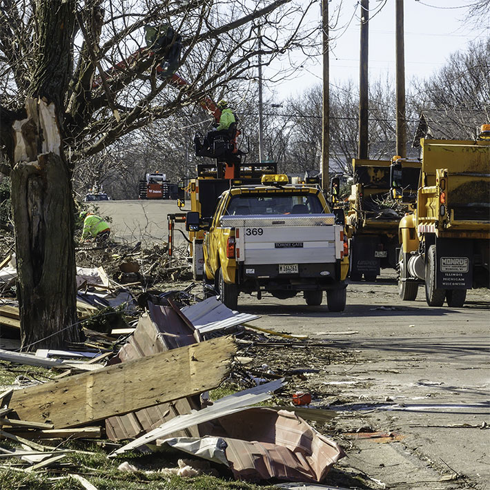 Emergency workers responding to clear roads of debris