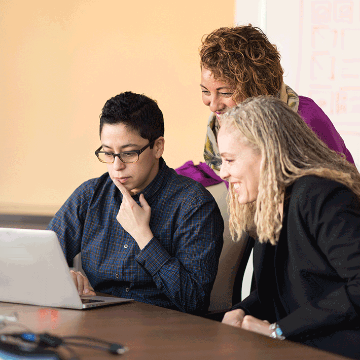 ARCOS teammates looking over utility operations at a table