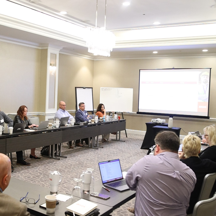 The Customer Steering Committee holding a presentation in a meeting room