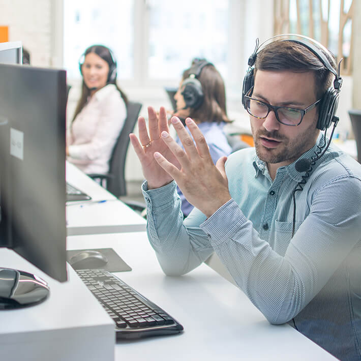 A utility support specialist providing customer support on the phone