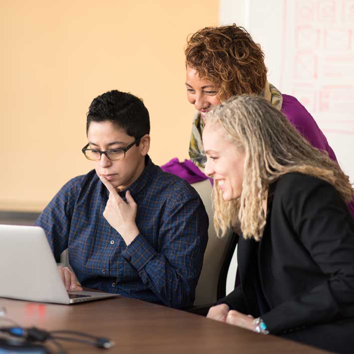 ARCOS teammates looking over utility operations at a table