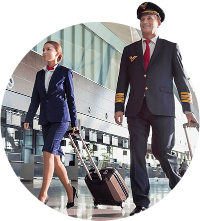 A stewardess and airline pilot walking to their terminal